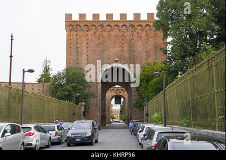 Gothic Porta Romana (Roman Gate) in city walls of Historic Centre of Siena listed World Heritage by UNESCO in Siena, Tuscany, Italy. 28 August 2017 ©  Stock Photo