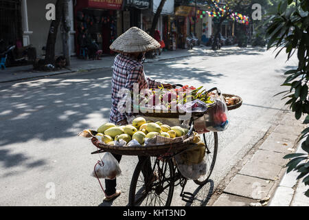 Woman selling fruit in Hanoi. Stock Photo
