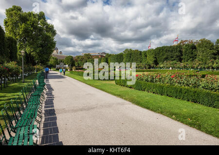 Austria, Vienna, Volksgarten (People's Garden), public park in the city centre, opened in 1823, alley with benches Stock Photo