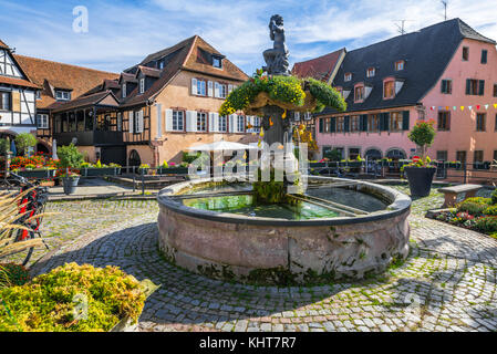 central fountain and old houses in the centre of the village Barr, on the Wine Route of Alsace, France Stock Photo