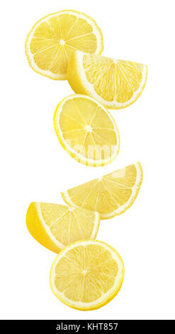 Isolated lemon slices in the air. Cut lemon fruit falling isolated on white background with clipping path Stock Photo