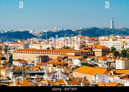 Aerial View Of Downtown Lisbon Skyline Of The Old Historical City And Cristo Rei Santuario (Sanctuary Of Christ the King Statue) In Portugal Stock Photo