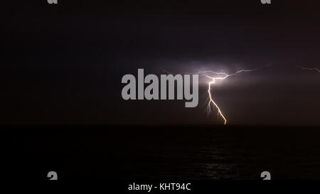 Lightning on the sky over the ocean Stock Photo
