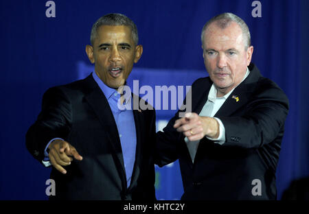 NEWARK,  NJ - OCTOBER 19: Former U.S. President Barack Obama walks on stage in support of Democratic candidate Phil Murphy, who is running against Republican Lt. Gov. Kim Guadagno for the governor of New Jersey on September 19, 2017 in Newark, New Jersey.   People:  Phil Murphy, Barack Obama Stock Photo