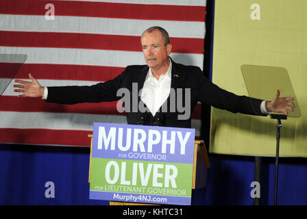 NEWARK,  NJ - OCTOBER 19: Former U.S. President Barack Obama walks on stage in support of Democratic candidate Phil Murphy, who is running against Republican Lt. Gov. Kim Guadagno for the governor of New Jersey on September 19, 2017 in Newark, New Jersey.   People:  Phil Murphy Stock Photo