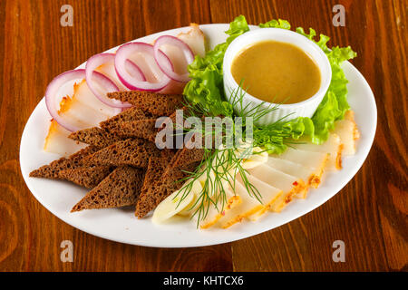 Pork fat snack with bread and mustard sauce Stock Photo