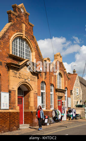 UK, England, Norfolk, The Brecks, Thetford, Magdalen Street, Edwardian era Salvation Army building, charity shop stock on pavement Stock Photo