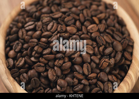 roasted coffee beans in wood bowl Stock Photo