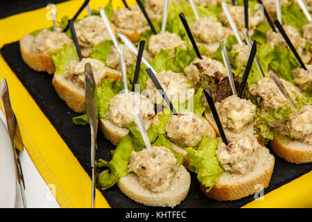 Canapes with chicken liver on toasted baguette. Snacks. buffet table. restaurant feed. New Year, Christmas Stock Photo