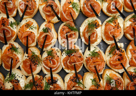salmon bruschetta or canapes close up. Healthy food. Fish appetizer. dark background. Snacks. buffet table. restaurant feed. New Year, Christmas Top v