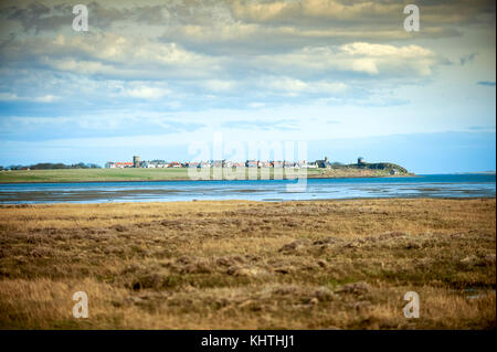 View of Lindisfarne (Holy Island) village from mainland, UK Stock Photo