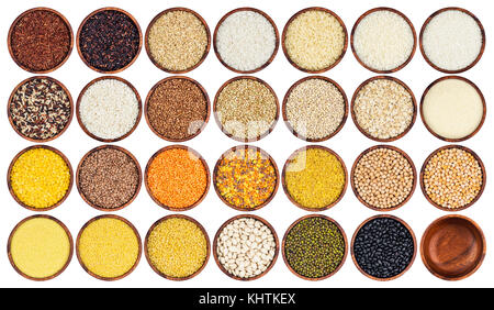 Collection of different groats isolated on white background. Top view of peas, cereals, rice, legumes, beans and lentils in wooden bowls. Stock Photo