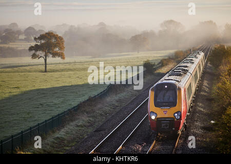 Autumn Cheshire, Tiverton, Tarporley. countryside a Virgin Voyager train headed for Hollyhead  Class 221 Super Voyager Stock Photo