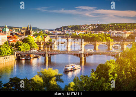 View of the Vltava River and the bridges shined with the sunset sun, Prague, the Czech Republic Stock Photo