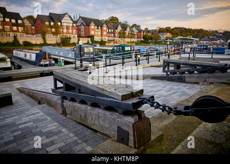 The River Weaver on the Northwich Marina featuring the oak benches that fit in with the historical loading trams of the salt industry. Autumn in North Stock Photo