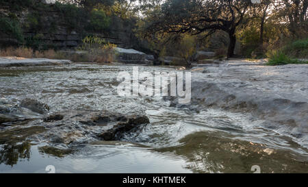 Low angle view of Water Stream At Sunset Stock Photo