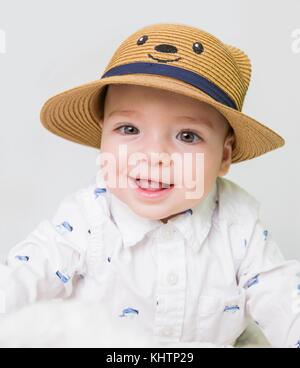 baby boy with straw hat Stock Photo