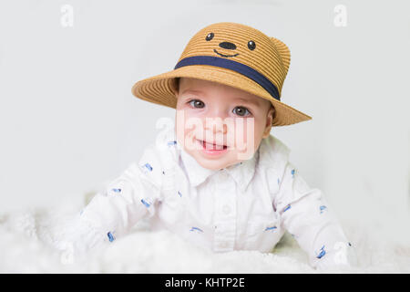 baby boy with straw hat Stock Photo