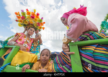 Buton teenagers parading using special traditional carrier called Kansodaan during Wakatobi Wave Festival. Stock Photo