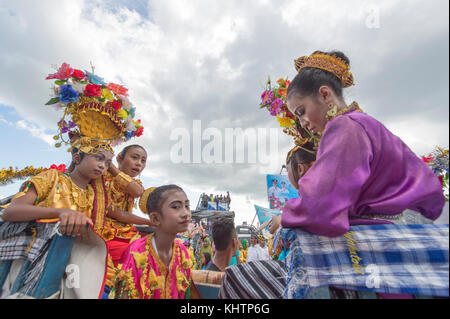 Buton teenagers parading using special traditional carrier called Kansodaan during Wakatobi Wave Festival. Stock Photo