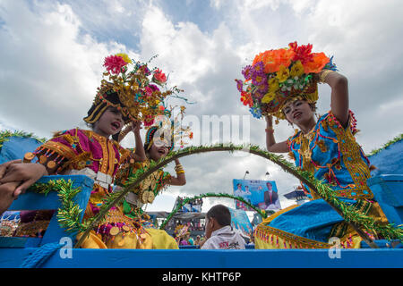 Buton teenagers parading using special traditional carrier called Kansodaan during Wakatobi Wave Festival. Stock Photo