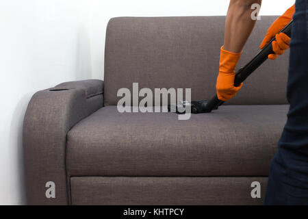 Cleaning Service man cleaning  floor with machine on Carpet to work Stock Photo