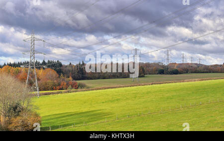 Row of Electricity Pylons in the Chiltern Hills in rural Buckinghamshire in England Stock Photo