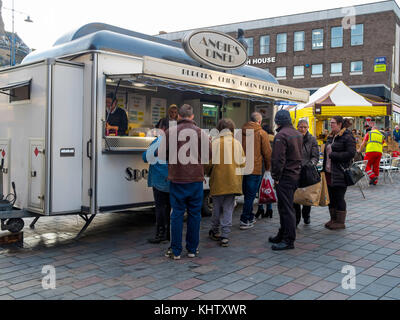 People queuing for food and drink Angie's Diner fast food stall in the weekly Market Darlington Co. Durham England UK Stock Photo