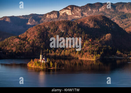 Bled, Slovenia - Beautiful autumn sunrise taken from Bled Castle with the famous Pilgrimage Church of the Assumption of Maria with Julian Alps at back Stock Photo