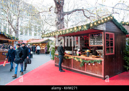 French raclette stall at Christmas in Leicester Square festival, Leicester Square, West End, City of Westminster, Greater London, England, United King Stock Photo