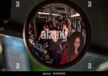 Standing room only, traveling on a crowded bus. Stock Photo
