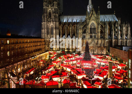 Public theater of Cologne Cathedral Chrismas Market with its typical LED Illumination and star shape. Stock Photo