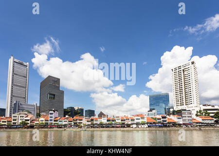 Singapore - October 6, 2017: The low rise buildings hosting bars and restaurants line the Clark Quay along the Singapore river on a sunny summer day i Stock Photo