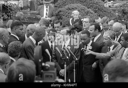 Photograph of Civil Rights leaders talking with reporters after meeting with President John F. Kennedy (1917-1963) after the March on Washington. Dated 20th Century