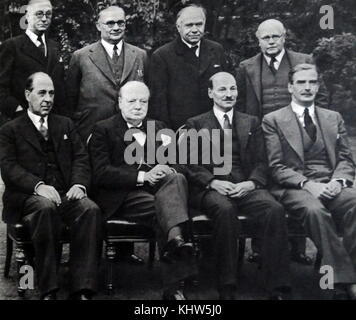 Photograph of Sir Winston Churchill sitting alongside other members of his War Cabinet. (Back row: left to right) Mr Arthur Greenwood (1880-1954) Deputy Leader of the Labour Party; Mr Ernest Bevin (1881-1951) Minister of Labour; Max Aitken, 1st Baron Beaverbrook (1879-1964) Minister of Aircraft Production; Sir Kingsley Wood (1881-1943) Chancellor of the Exchequer. (Front row: left to right) John Anderson, 1st Viscount Waverley (1882-1958) Lord President of the Council; Sir Winston Churchill (1874-1965) Prime Minister of the United Kingdom; Clement Attlee (1883-1967) Lord Privy Seal. Stock Photo