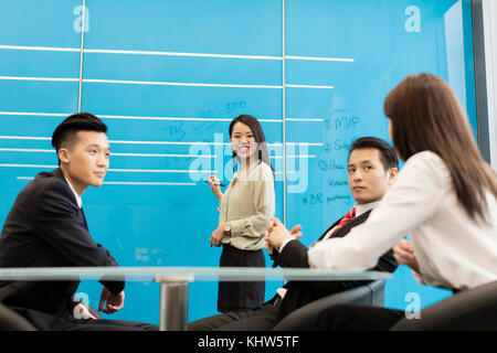 Colleagues having meeting in boardroom Stock Photo