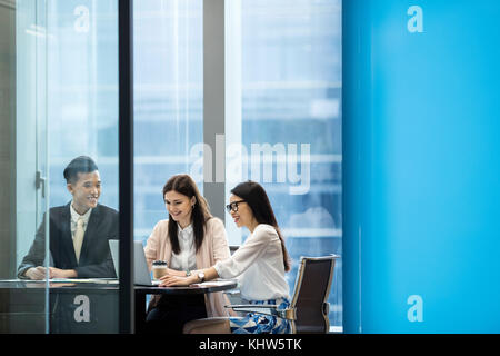 Colleagues having meeting in boardroom Stock Photo
