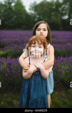 Sisters in lavender field, Campbellcroft, Canada Stock Photo