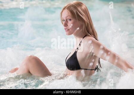 Woman relaxing in spa pool Stock Photo