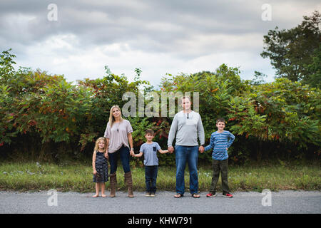 Family of five enjoying outdoors Stock Photo