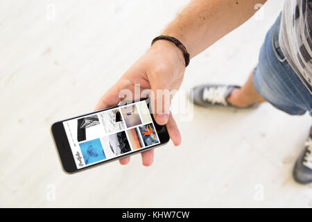 closeup of male hand using white screen smartphone portfolio Stock Photo