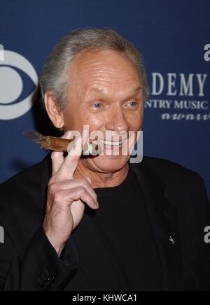 MEL TILLIS (born Lonnie Melvin Tillis, August 8, 1932 - November 19, 2017) was an American country music singer and songwriter. His biggest success occurred in the 1970s, with a long list of Top 10 hits including 'I Ain't Never', 'Good Woman Blues', and 'Coca-Cola Cowboy'. He was awarded the National Medal of Arts, and the Country Music Association Awards' most coveted award, 'Entertainer of the Year'. Tillis was known for his speech impediment, which didn't affect his singing voice. PICTURED: May 26, 2004 - Las Vegas, Nevada, U.S. - MEL TILLIS mugs for the cameras during the 39th Annual Acade Stock Photo