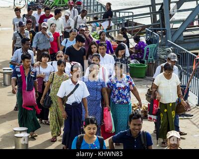 Yangon, Yangon Region, Myanmar. 20th Nov, 2017. Passengers walk down to the Dala Ferry from the Dala terminal. Tens of thousands of commuters ride the ferry every day. It brings workers into Yangon from Dala, a working class community across the river from Yangon. A bridge is being built across the river, downstream from the ferry to make it easier for commuters to get into the city. Credit: Jack Kurtz/ZUMA Wire/Alamy Live News Stock Photo