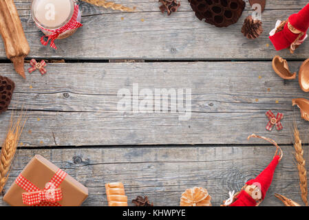 Gold and red color Christmas decorations on wooden table. Background image for text. Top view. Stock Photo