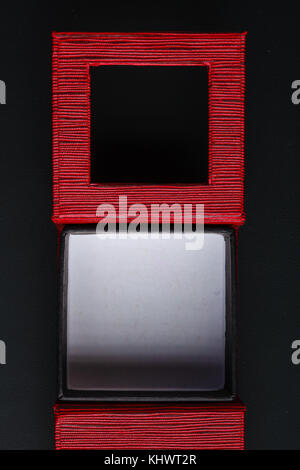 Red black rectangular ring jewellery box on dark background Stock Photo
