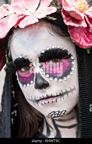 A young Mexican woman dressed in La Calavera Catrina costume for the Day of the Dead or Día de Muertos festival October 31, 2017 in Patzcuaro, Michoacan, Mexico. The festival has been celebrated since the Aztec empire celebrates ancestors and deceased loved ones. Stock Photo