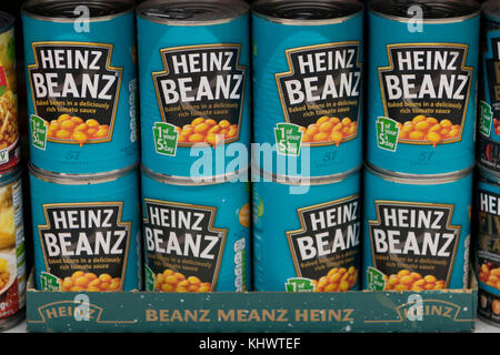 Cans of baked beans on sale in a supermarket in the UK.