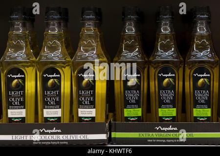 Bottles of light and extra virgin olive oil on sale in a supermarket store in the UK. Stock Photo