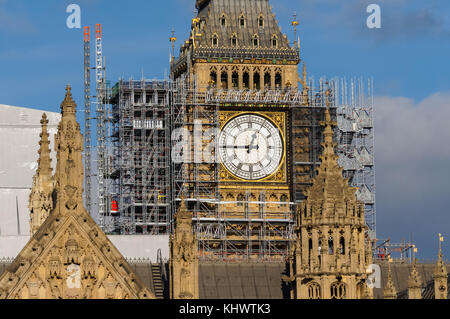 Elizabeth Tower (Big Ben) and the Palace of Westminster covered in scaffolding during maintenance work, London England United Kingdom UK Stock Photo