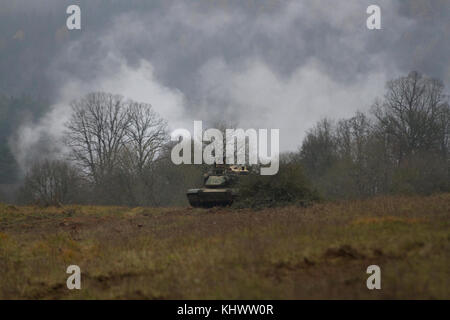 Soldiers from 2nd Armored Brigade, 1st Infantry Division in their M1A2 SEPv2 Abrams Main Battle Tank, conduct a battle against opposing forces during Allied Spirit VII at the 7th Army Training Command's Hohenfels Training Area, Germany, Oct. 30 to Nov. 22, 2017. Allied Spirit is a U.S. Army Europe-directed, 7ATC-conducted multinational exercise series designated to develop and enhance NATO nations interoperability and readiness. Stock Photo